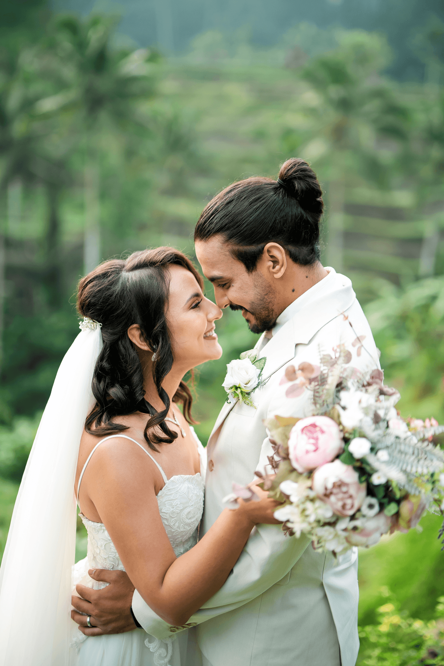 Happy wedding couple with bouquet